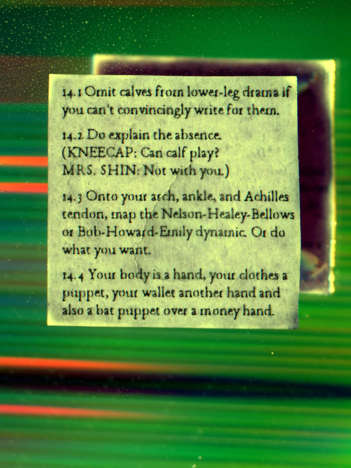text backed by mirror reflecting rainbow colors and blueberry juice on back of paper